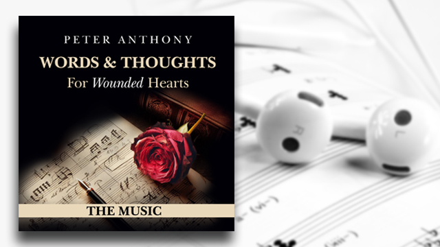 album cover with ear buds and music sheet
